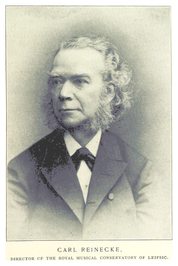 Schwarzes und weißes Foto von Carl Reinecke, Direktor des Königlichen Musik-Konservatoriums Leipzig, in Anzug, mit Text unten.